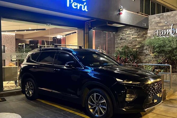 Airport Transportation Service With SUV - Finding your driver fast: the airport doors and the blackboard sign