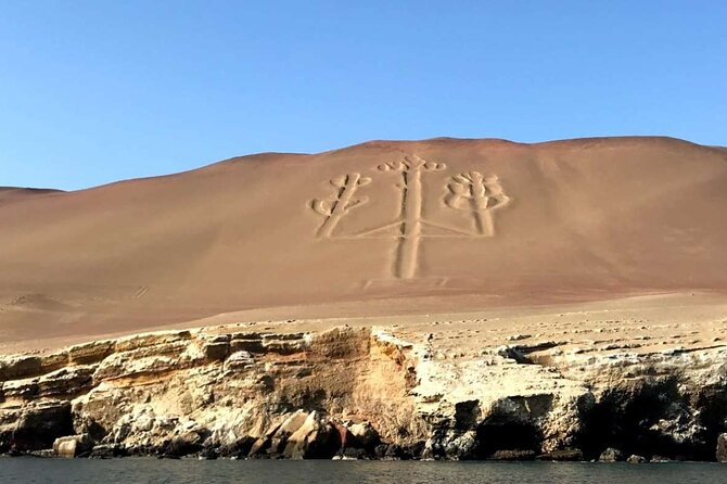 Ballestas Islands Tour Boat with roof - El Candelabro de Paracas from the boat, what you should look for