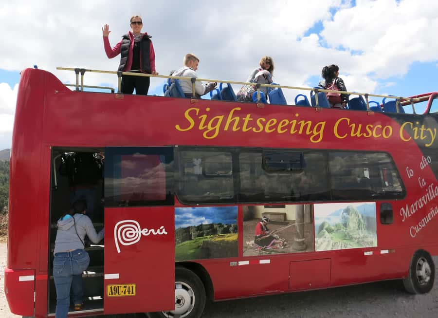 Cusco: open-top bus city tour - The white Statue of Christ stop, skyline views and photo time