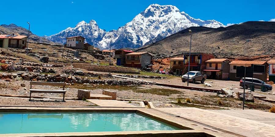 From Cusco: 7 Lakes Ausangate Trek with Breakfast and Lunch - Pacchanta setup: cold gear, sunglasses, and the first Ausangate moment