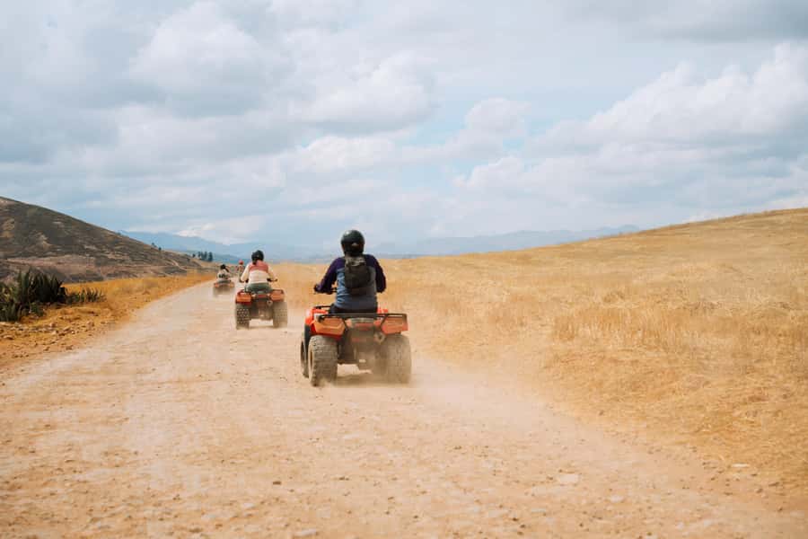 From Cusco: ATV Adventure to Moray & Maras Salt Mines - Maras Salt Mines: thousands of pools in bright sunlight