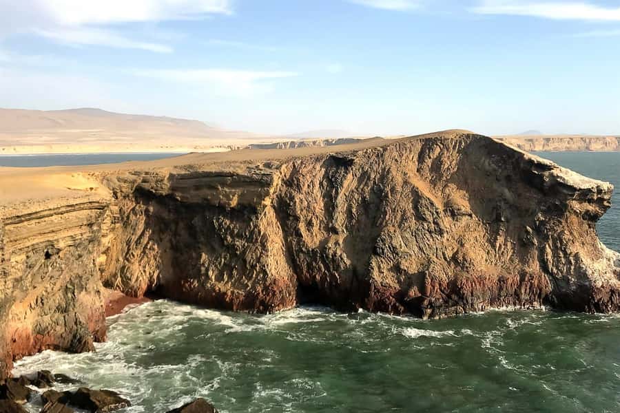 From Paracas: Ballestas Islands & Paracas National Reserve - Playa Roja and Lagunillas: maroon sand where the ocean keeps moving