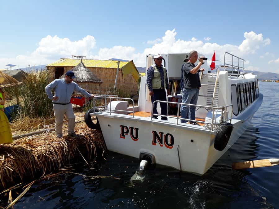 From Puno: full day tour to Uros and Taquile with Lunch - Taquile Island: hike up, guided info, lunch, then the downhill