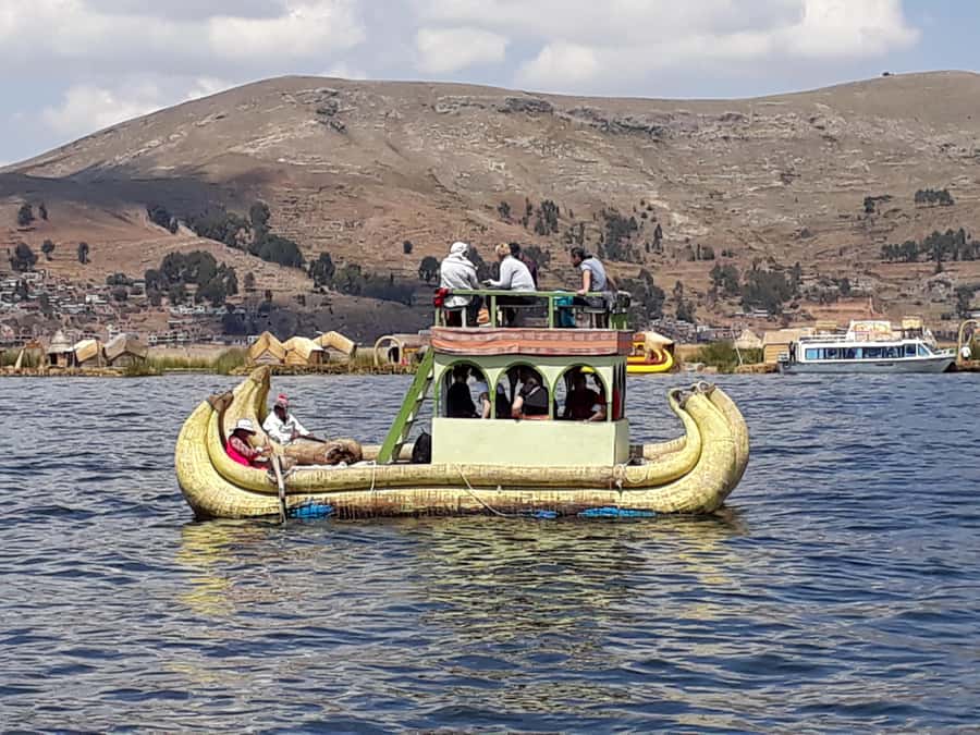 From Puno: full day tour to Uros and Taquile with Lunch - Uros Floating Islands: Totora homes and the optional reed raft ride