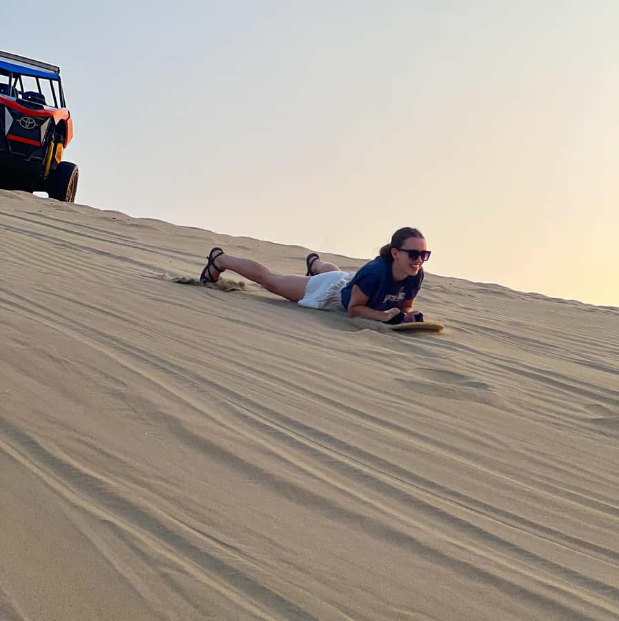 Ica/Huacachina: Crazy buggy in the dunes at sunset + sand sled - Sandboarding With Straps on Several Dunes (Yes, You Will Actually Go)