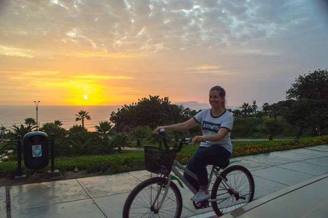 Lima Bike Tour Miraflores - Barranco + Huaca Pucllana! - Buena Vista Cafe to the coast: Faro La Marina, paragliding views, and ocean light
