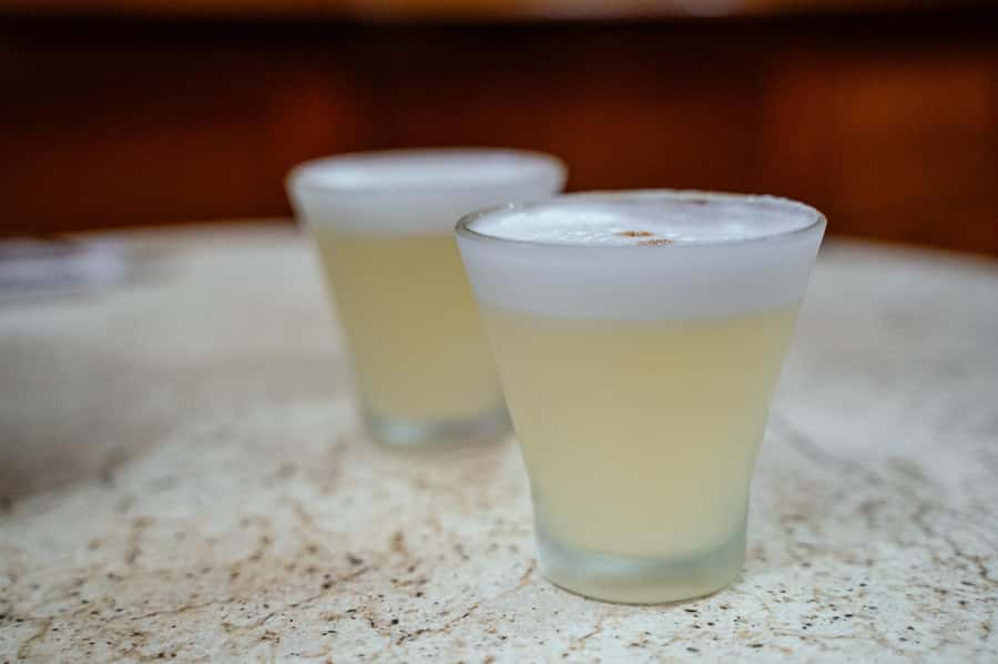 Lima: Flavors and Tradition Walking Tour with Food Tasting - San Francisco Church Stop: Churros, Papita con Huevo, and the Pisco Sour Moment