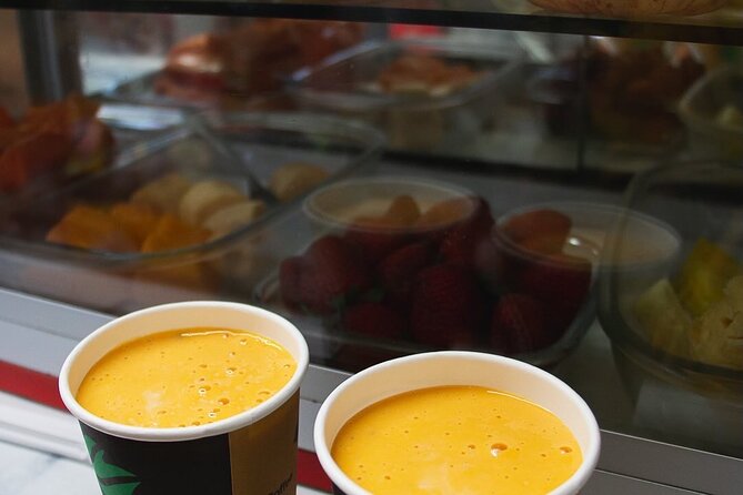 Miraflores Tasting Experience with a Chef - Surquillo market sampling: native fruits, veggies, and Lucuma juice