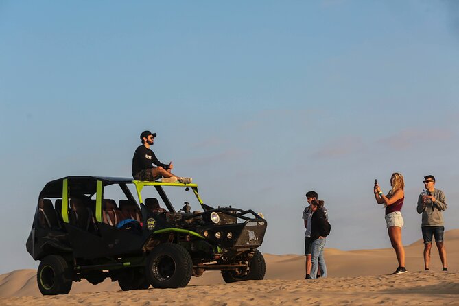 PARACAS and HUACACHINA SANDBOARD - Day Trip Lima - Huacachina oasis at sunset time: sand dunes and orange sand