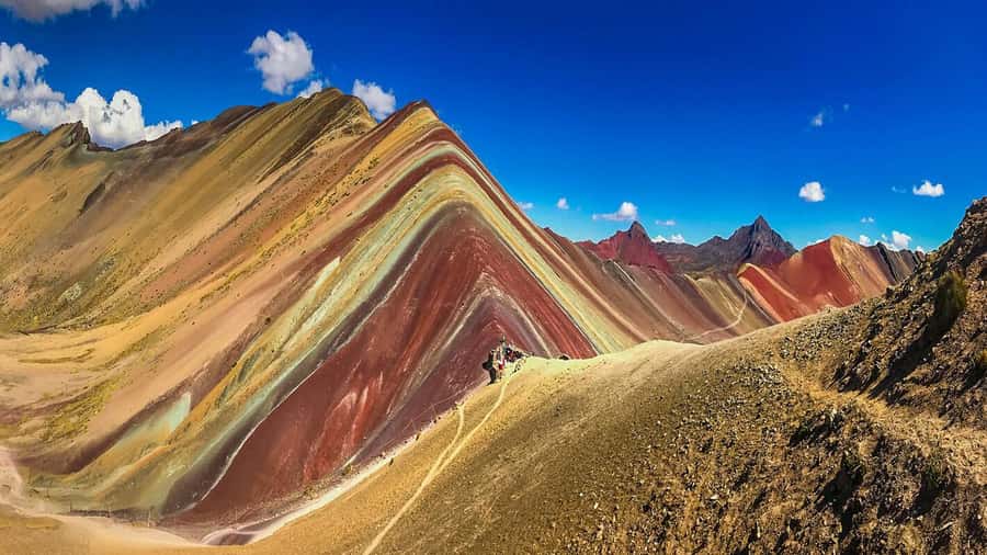 Rainbow Mountain tour and Machu Picchu tour by train - Lunch in Aguas Calientes and Optional Hot Springs